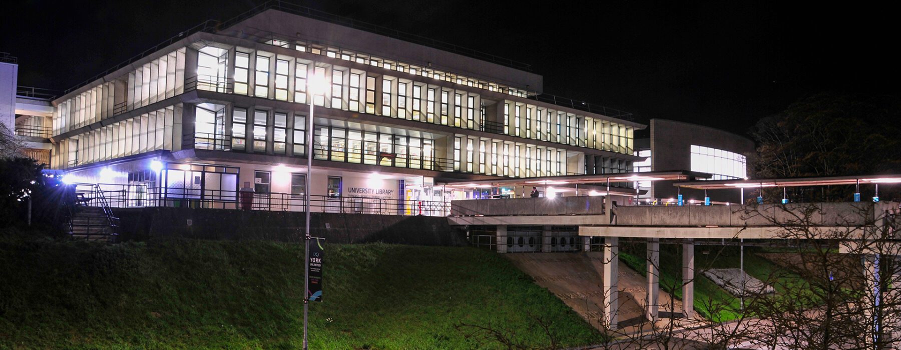 The University of York library lit up at night